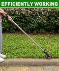 Person using Heavy Duty Rotary Wheel Lawn Edger With Adjustable 23.6 To 67 Inch Length, Stainless Steel Handle And Sharp Serrated Blades on sidewalk edge.