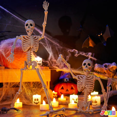 Two Pack 16 Inch Poseable Hanging Skeletons with Movable Joints for Halloween Decor in spooky scene with candles and cobwebs