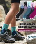 Womans legs wearing blue hiking socks on rocky terrain, Womens Merino Wool Hiking Socks For Cold Weather Thermal Warm Crew Socks With Cushioned Comfort Cozy Fit 5 Pair Gift Set In Dark Gray Black Rose Red Sizes Medium And Large
