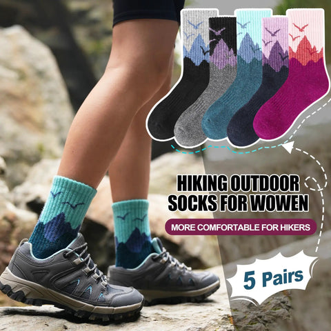 Womans legs wearing blue hiking socks on rocky terrain, Womens Merino Wool Hiking Socks For Cold Weather Thermal Warm Crew Socks With Cushioned Comfort Cozy Fit 5 Pair Gift Set In Dark Gray Black Rose Red Sizes Medium And Large