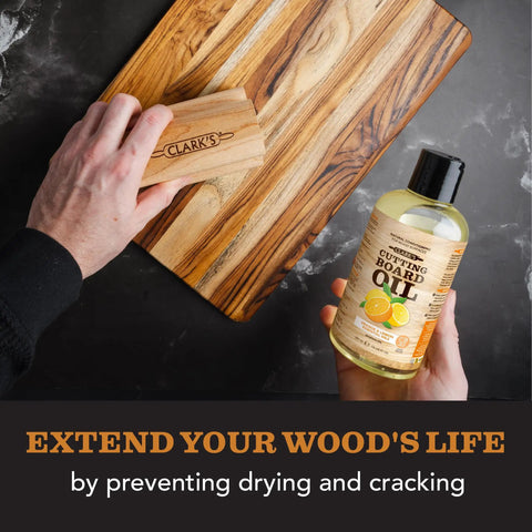 Cutting Board Oil With Lemon And Orange Oils Food Grade Mineral Oil For Cutting Boards And All Wood Surfaces Keeps Your Boards Looking Fresh Restores And Protects Butcher Block Nourishing Conditioner 12 Oz bottle next to wooden board