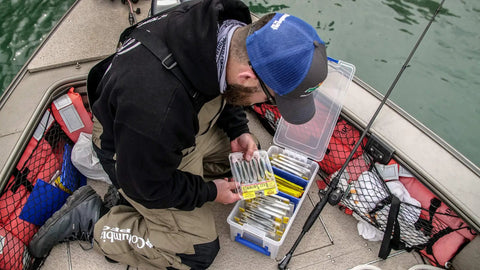 Person organizing soft bait in Clear Fishing Organizer Case With Adjustable Dividers For Soft Bait Lures And Tackle Tuff Tainer.