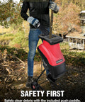 Person using an Electric Wood Chipper Shredder For Yard Cleanup That Really Chews Through Branches 21 To 1 Reduction