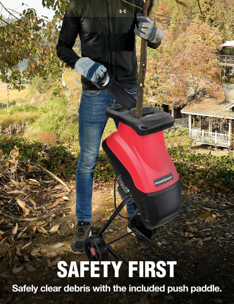 Person using an Electric Wood Chipper Shredder For Yard Cleanup That Really Chews Through Branches 21 To 1 Reduction