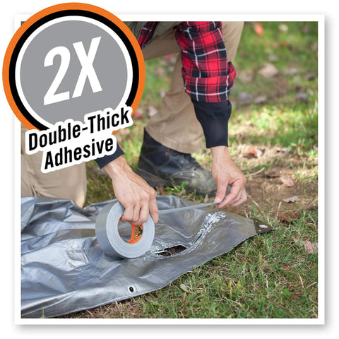 Person applying Heavy Duty Silver Duct Tape 1.88 Inch By 35 Yard Double Thick Adhesive With Reinforced Backing to outdoor tarp