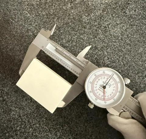 Six Inch Dial Caliper With Dual Metric And SAE Readout, Pro Grade Precision 0.001 Inch Resolution measuring object, focus on dial.