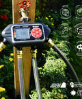 Four Zone Programmable Digital Water Timer with Easy Setup and Large LCD, connected to garden hoses, in outdoor lawn setting