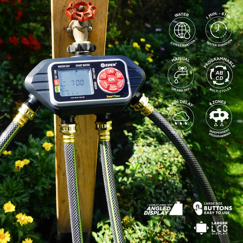 Four Zone Programmable Digital Water Timer with Easy Setup and Large LCD, connected to garden hoses, in outdoor lawn setting