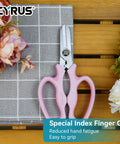 7.5 Inch Garden Shears Pruner Secateurs With Integrated Stab Remover, ergonomic pink hand tool on table with flowers