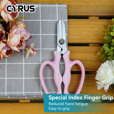 7.5 Inch Garden Shears Pruner Secateurs With Integrated Stab Remover, ergonomic pink hand tool on table with flowers