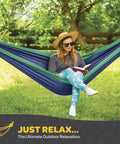 Woman reading in a Durable Nylon Camping Hammock Chair With 400 Lbs Capacity Single Or Double Size Tree Straps Attached, Blue