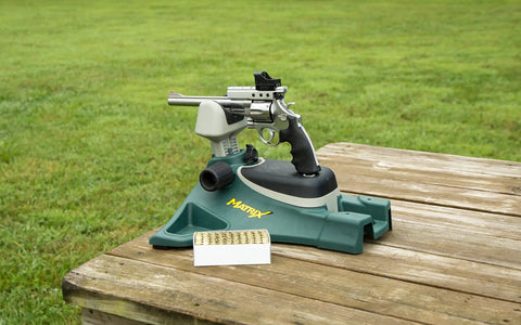 Matrix Adjustable Ambidextrous Rifle And Pistol Shooting Rest for range and precision shooting on a wooden table outdoors.