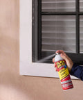Applying White 14 Oz Waterproof Rubber Spray On Sealant Coating That Stops Leaks Instantly Flexible After Drying Ideal For Gutters Wood RVs Campers Roofs Skylights Windows And More on window frame