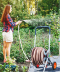 Person using 1 Ft Female To Female Garden Hose Connector Heavy Duty Metal Reel Connection Hose Stainless Steel Flexible No Leak Outdoor Water Pipe Extension Adapter For Hose Reels
