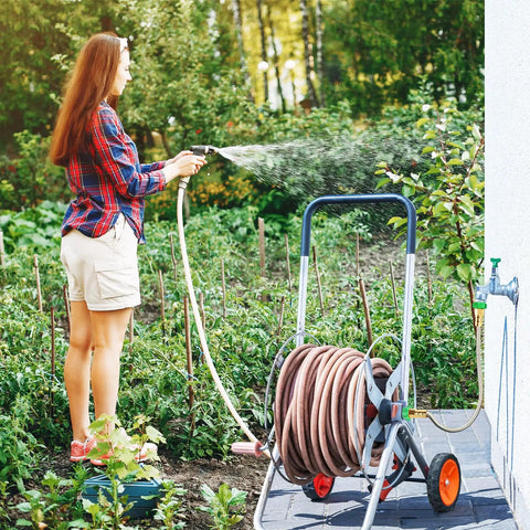 Person using 1 Ft Female To Female Garden Hose Connector Heavy Duty Metal Reel Connection Hose Stainless Steel Flexible No Leak Outdoor Water Pipe Extension Adapter For Hose Reels