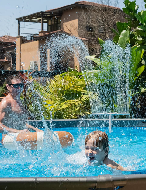 Adjustable Dual Spray Pool Fountain For Above Ground And In Ground Pools High Pressure Waterfall Sprinkler splashing over swimmers