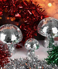 Mushroom Disco Ball Set Of Four, Silver Mirror Glitter Balls For Stage And Home Party Decor, 4 Inch, 4 Inch, 6 Inch And 7 Inch, displayed with festive tinsel