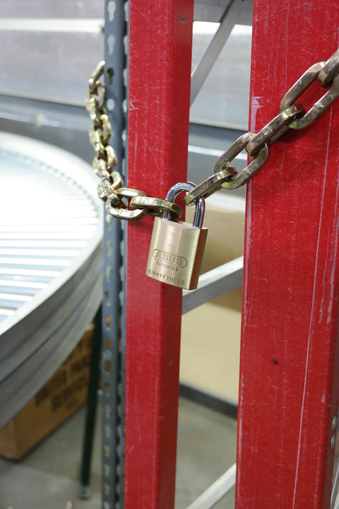 Brass 45mm Padlock Built Tough For Toolboxes Gates And Storage Units High Security Grade With Zero Bitted Core securing a gate