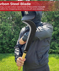 Person holding Badass Leather Wrapped Slasher Crescent Outdoor Bamboo Sickle Scythe Machete Knife in outdoor setting.