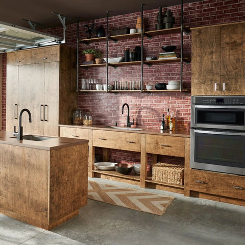 Rustic kitchen with a brick wall and wooden cabinets featuring a slick matte black deck mounted soap and lotion dispenser pump.