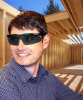 Worker wearing Smith And Wesson Magnum 3G Safety Glasses With Black Frame And Smoke Lenses at a construction site, ANSI Z87.1 Plus Rated.