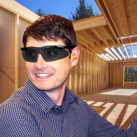 Worker wearing Smith And Wesson Magnum 3G Safety Glasses With Black Frame And Smoke Lenses at a construction site, ANSI Z87.1 Plus Rated.