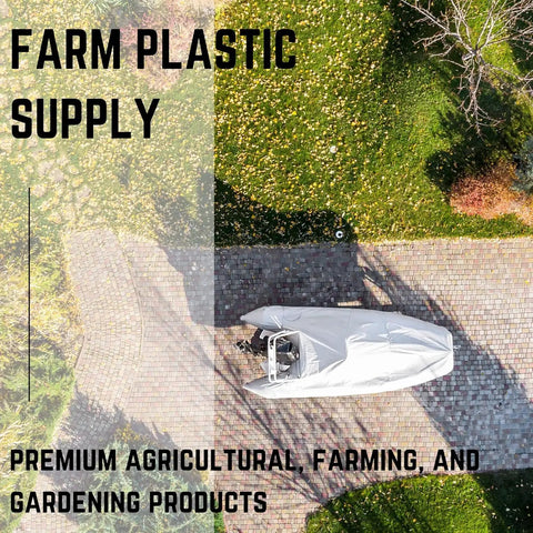Rock Solid 7 Mil Polyethylene Shrink Wrap Roll For Boat Winter Storage UV Resistant Plastic Sheeting over a boat on a driveway.