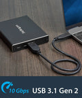 Dual Slot M.2 Sata Raid Enclosure Usb 3.1 10Gbps External Drive Holder connected to laptop on wooden desk.