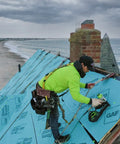 Durable Badass Pneumatic Cap Nailer Built Like Steel For Smashing Roofing Underlayment Sheets With Huge Capacity Magazine And Smooth Bump Fire Trigger Action used on a roof installation.