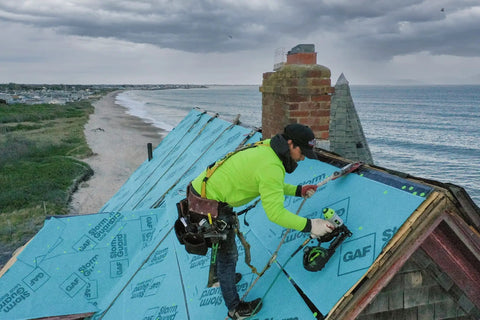 Durable Badass Pneumatic Cap Nailer Built Like Steel For Smashing Roofing Underlayment Sheets With Huge Capacity Magazine And Smooth Bump Fire Trigger Action used on a roof installation.