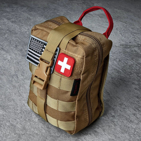 CareTac IFAK trauma medical pouch in tan with red cross patch and American flag patch