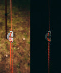 Paracord 175 Lightweight Visible Guyline For Tents And Tarps Reflective Orange 100 Ft Camping Cord with metal clip in day and night view