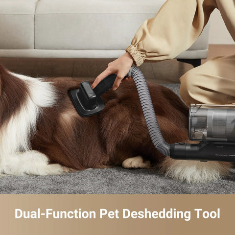 Game Changing Cordless Vacuum Cleaner With 850W Motor And 90 Minute Runtime Kicks Out Stubborn Pet Hair And Deep Grit For Effortless One Pass Cleaning Across Carpets And Smooth Hardwood Floors using a deshedding tool on a dog.
