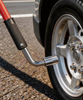 Close-up of 4400 Lb Hydraulic Off Road Floor Jack with Big Wheels for Trucks SUVs and ATVs, dual piston quick lift, on pavement.