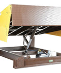 Hardcore Workhorse Electric Hydraulic Dock Leveler With 25000 Pound Capacity And 72 By 110 Inch Platform showing hydraulic lift mechanism.