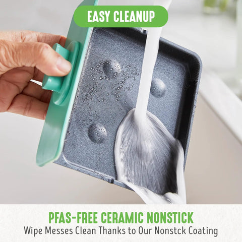 Close-up of hand washing ceramic nonstick tray from 3 In 1 Breakfast Station With Ceramic Nonstick Dual Griddles For Eggs Sausage Bacon Pancakes And Breakfast Sandwiches, 2 Slice Toast Drawer And Easy Timer Turquoise Kitchen Appliance under running water.