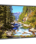 Heavy Duty 70 Inch Led Business Display Built Like A Tank Featuring Dual Hdmi Vga Dvi Displayport Lan Control Ops Slot Plug And Play Ready Slick Professional Black Housing showcasing nature scene.