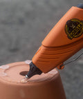 Glue gun applying weatherproof hot glue sticks 4 inches long by 0.43 inches diameter clear pack of two with 90 sticks on clay pot
