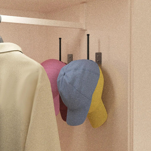 Heavy Duty Stainless Steel Hat Organizer And Hat Rack For Wall Built Tough To Store Your Favorite Baseball Caps Without Breaking A Sweat hanging three caps in a closet.