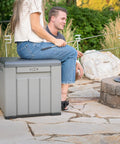 Versatile Outdoor Storage Cube Deck Box doubles as cozy bench seat while fishing, compact and weather resistant.