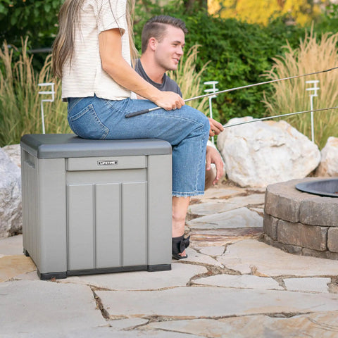 Versatile Outdoor Storage Cube Deck Box doubles as cozy bench seat while fishing, compact and weather resistant.