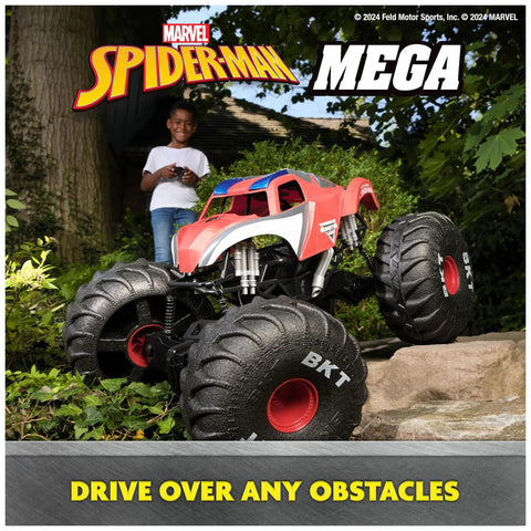 Spider Man RC Monster Truck Mega Size Over Two Feet Long One Six Scale All Terrain Off Road Toy For Kids Four And Up with large wheels on rocky terrain.