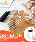 Pro Grade Dough Blender For Cutting Cold Butter Into Flour Like A Kitchen Boss With Heavy Duty Stainless Steel Blades Ideal For Pastry And Bread Dough Medium Size Black Kitchen Tool on a wooden board next to a glass jar of treats.