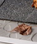 6 Inch Gutter Guard Kit, 48 Ft with Screws and Setter, stainless steel micro mesh covered by dry leaves on a roof