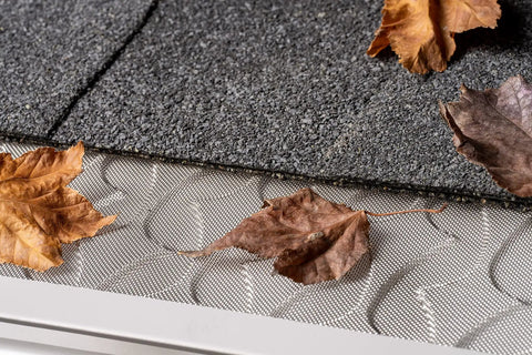 6 Inch Gutter Guard Kit, 48 Ft with Screws and Setter, stainless steel micro mesh covered by dry leaves on a roof