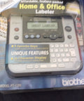 P-Touch Label Maker Electronic Labeling System For Home Office And Outdoor Use in packaging showing display and keys