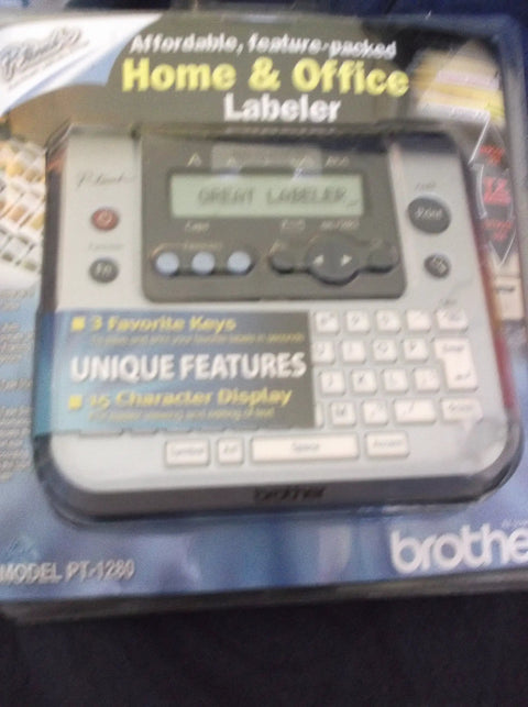 P-Touch Label Maker Electronic Labeling System For Home Office And Outdoor Use in packaging showing display and keys