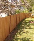 Built Different Exterior Wood Stain And Heavy Duty Fence Guard With Seriously Tough Water Repellent Finish Sierra Cedar Tint on new wooden fence.