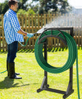 Heavy Duty Metal Garden Hose Holder And Hanger Freestanding Water Hose Storage Rack with dual hooks in use outdoors
