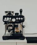 54mm Bottomless Naked Portafilter For Breville Barista Express And Barista Pro fitted in espresso machine